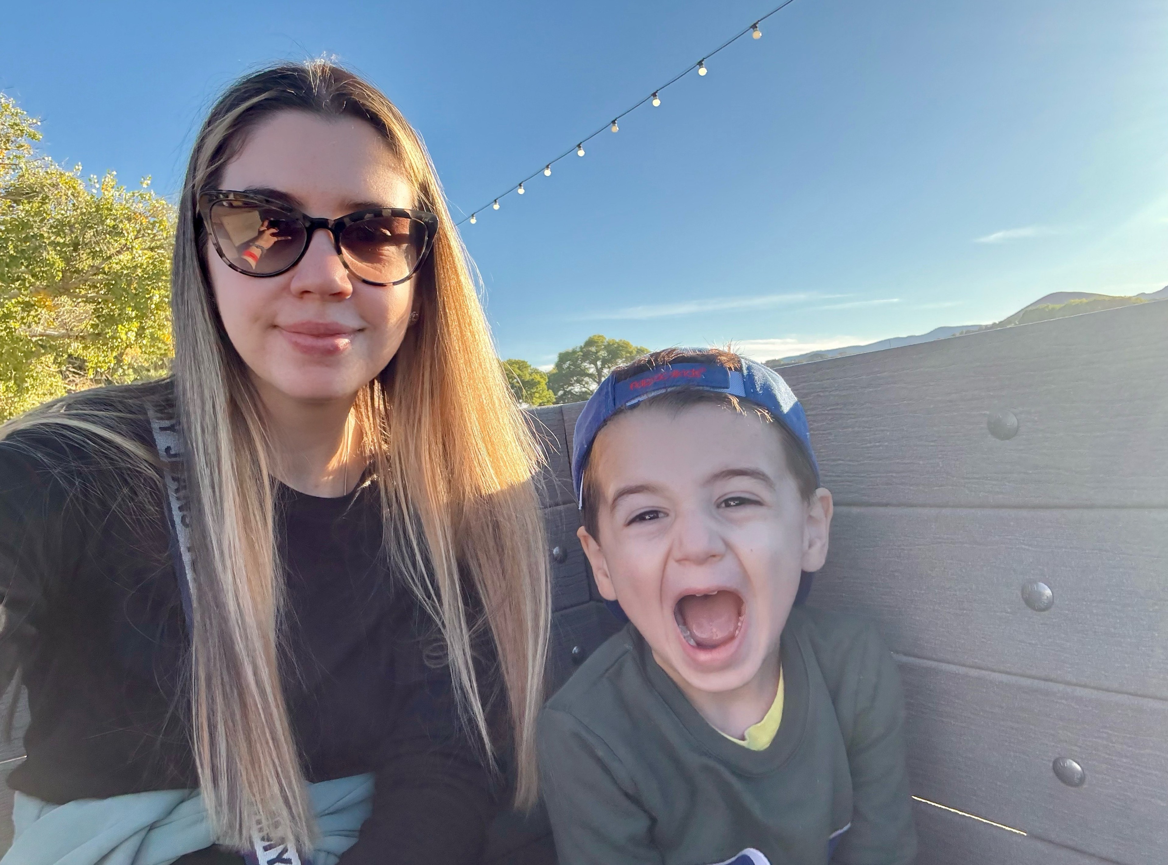 Happy family enjoying their photo magnets